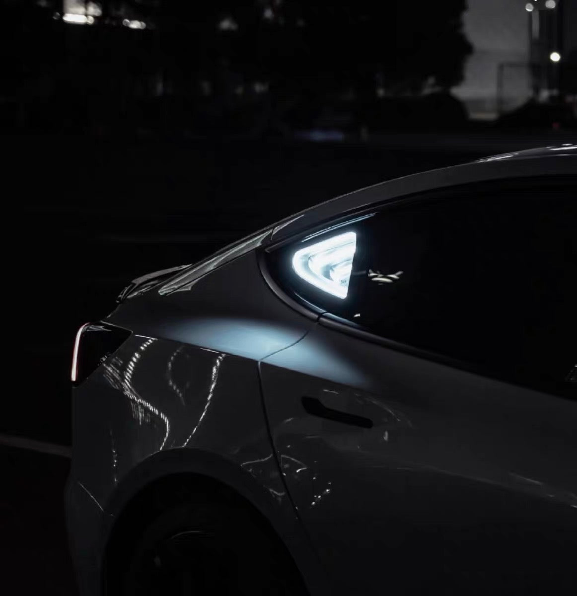 AnimeCarMod Deep Mirror Multi-Mode Light Quarter Window Diorama showing illuminated diorama scene with remote control in a car window.